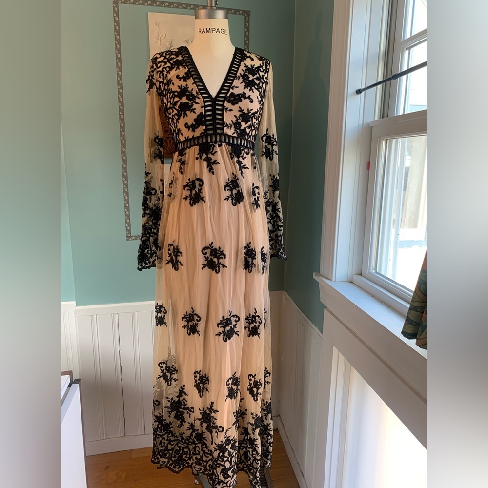 Floor length long sleeve black lace and nude mesh gown